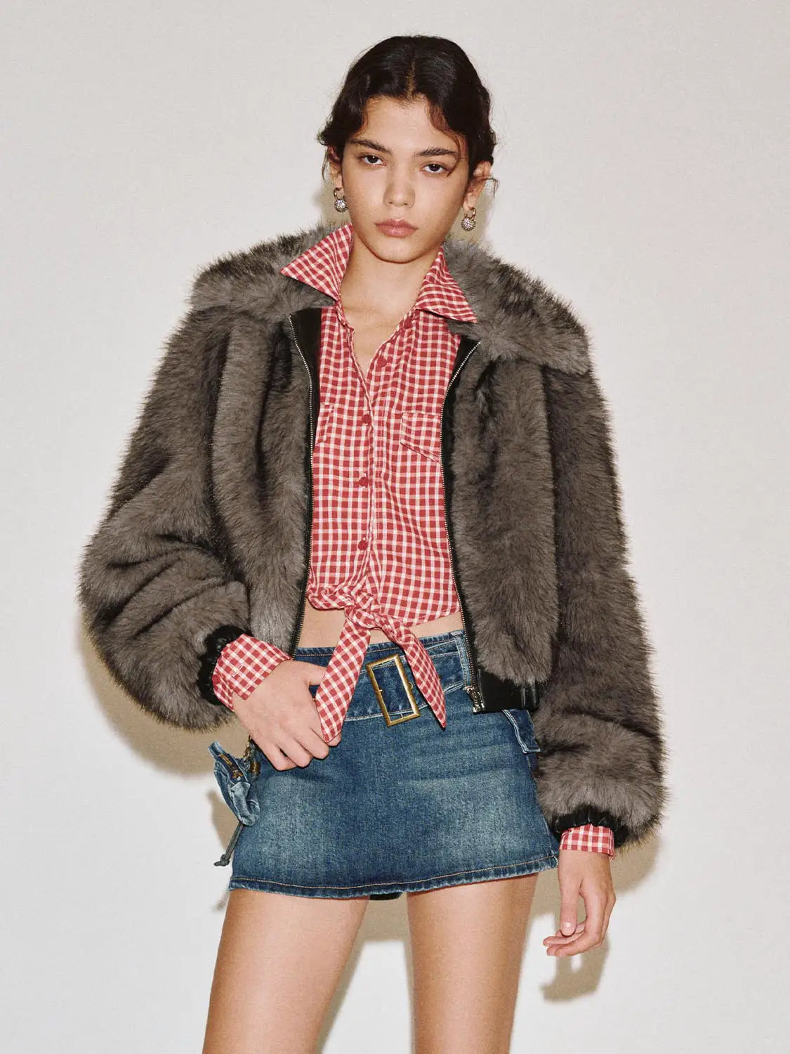 Fur coat by Urban Revivo Fashion in gray faux fur worn over red gingham shirt and denim mini skirt
