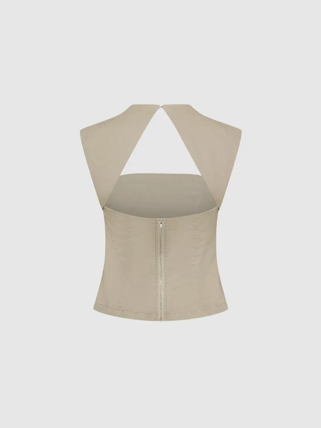 Beige sleeveless blouse with wide back panels forming a triangular back cutout and center zipper