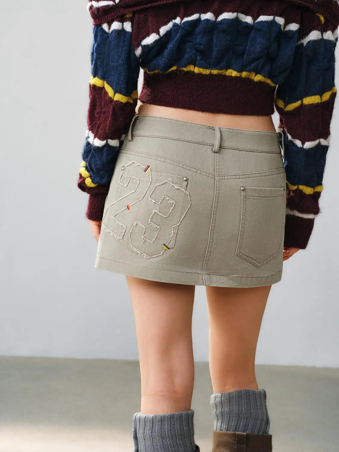 Straight skirt in beige khaki with back pocket and large stitched number patch