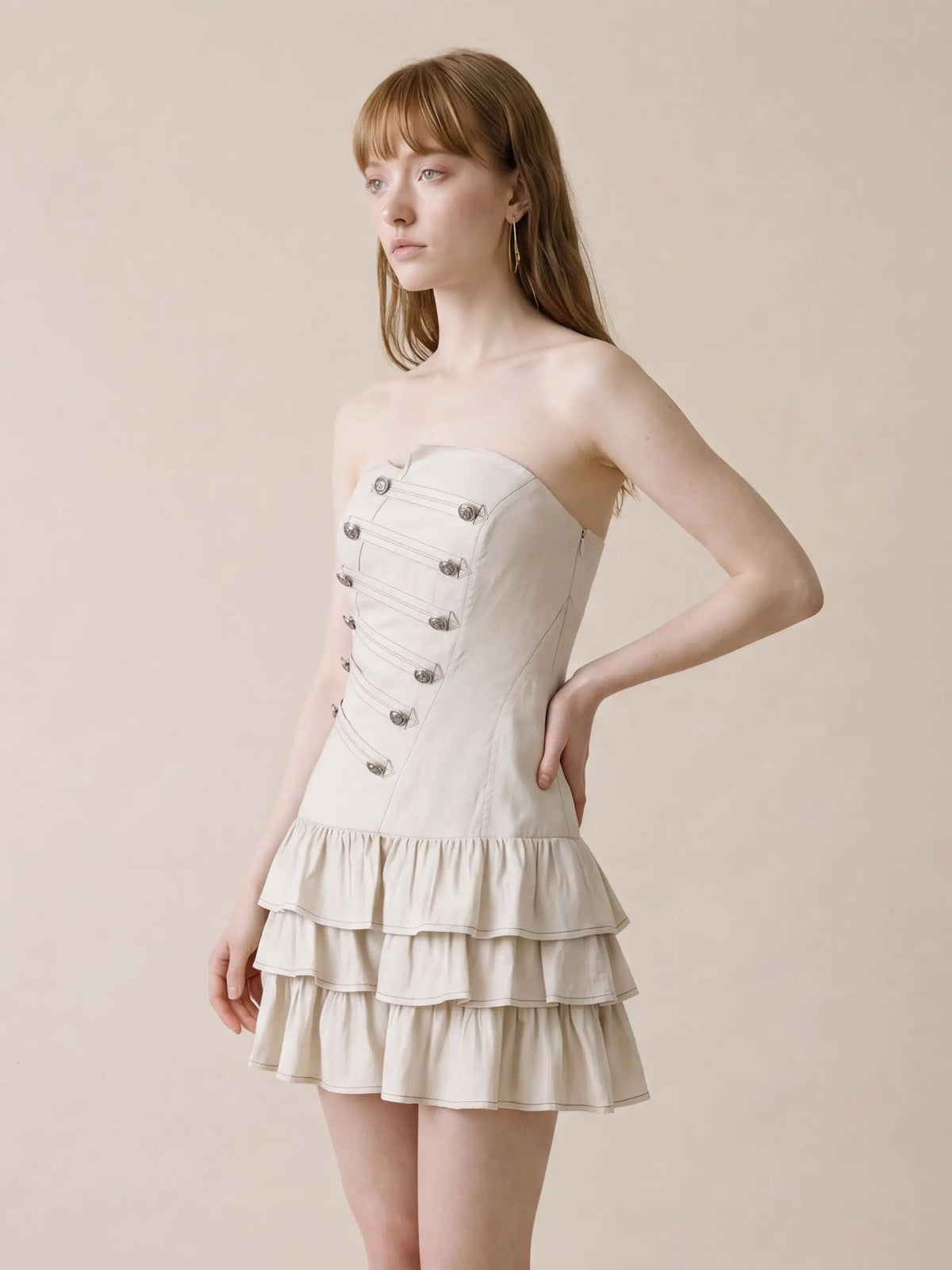 Strapless corset bodice dress in beige cotton-linen with tiered ruffle hem