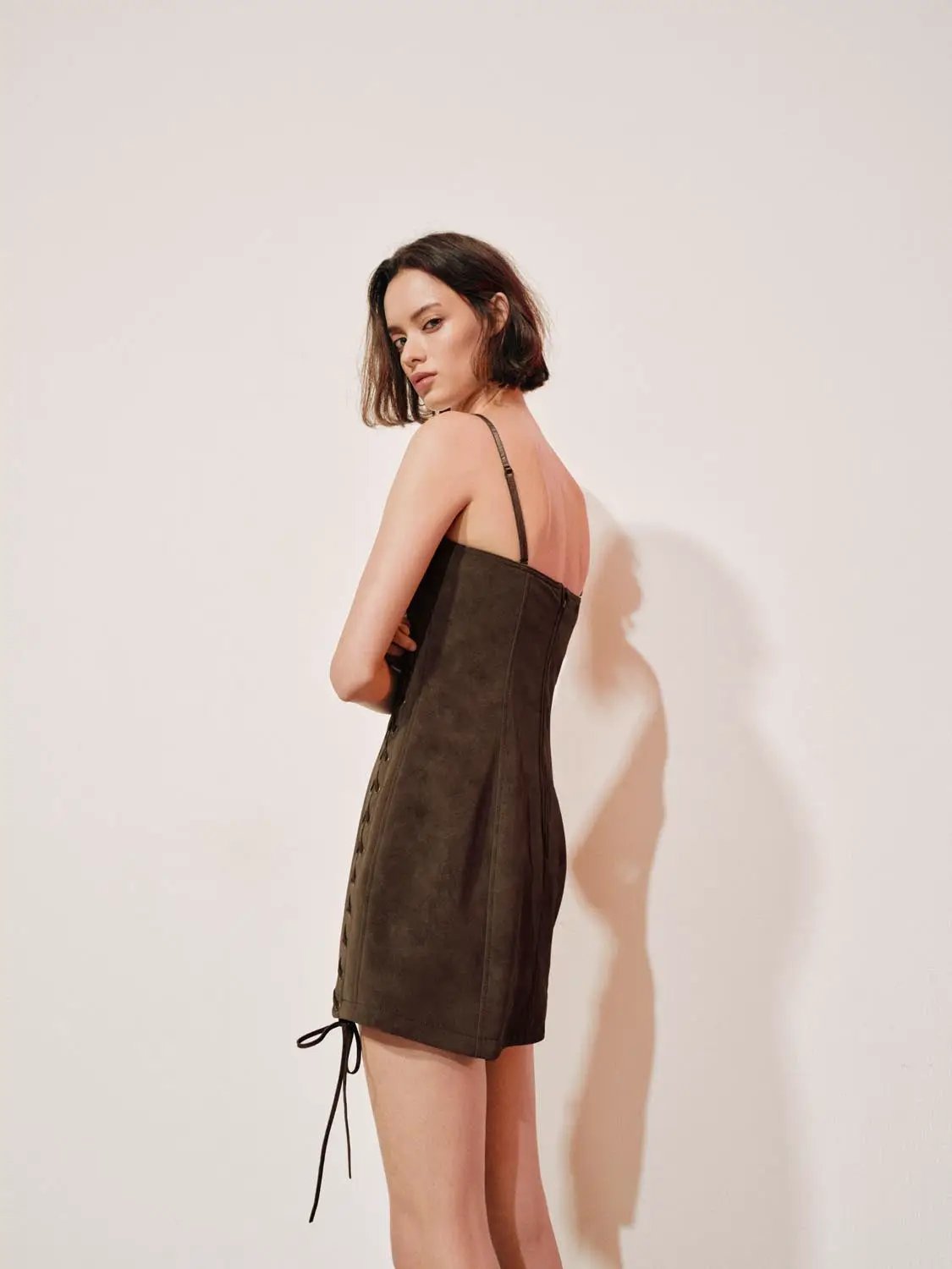 Lace-up faux suede corset sleeveless mini dress, dark brown, worn by model.