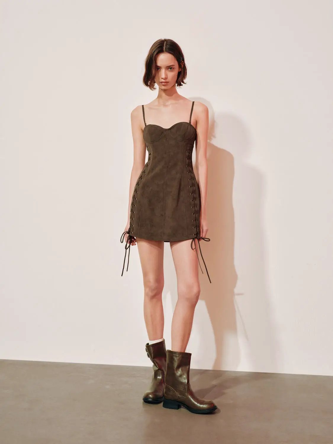 Lace-up faux suede corset mini dress in olive brown with side lacing and spaghetti straps; Urban Revivo Fashion