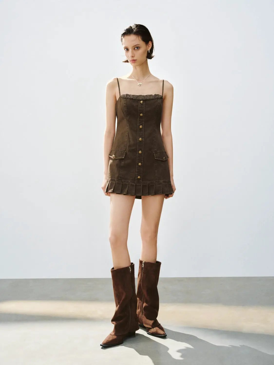 A-Line Dress in brown denim with button-down front, lace-trim neckline, and pocket flaps