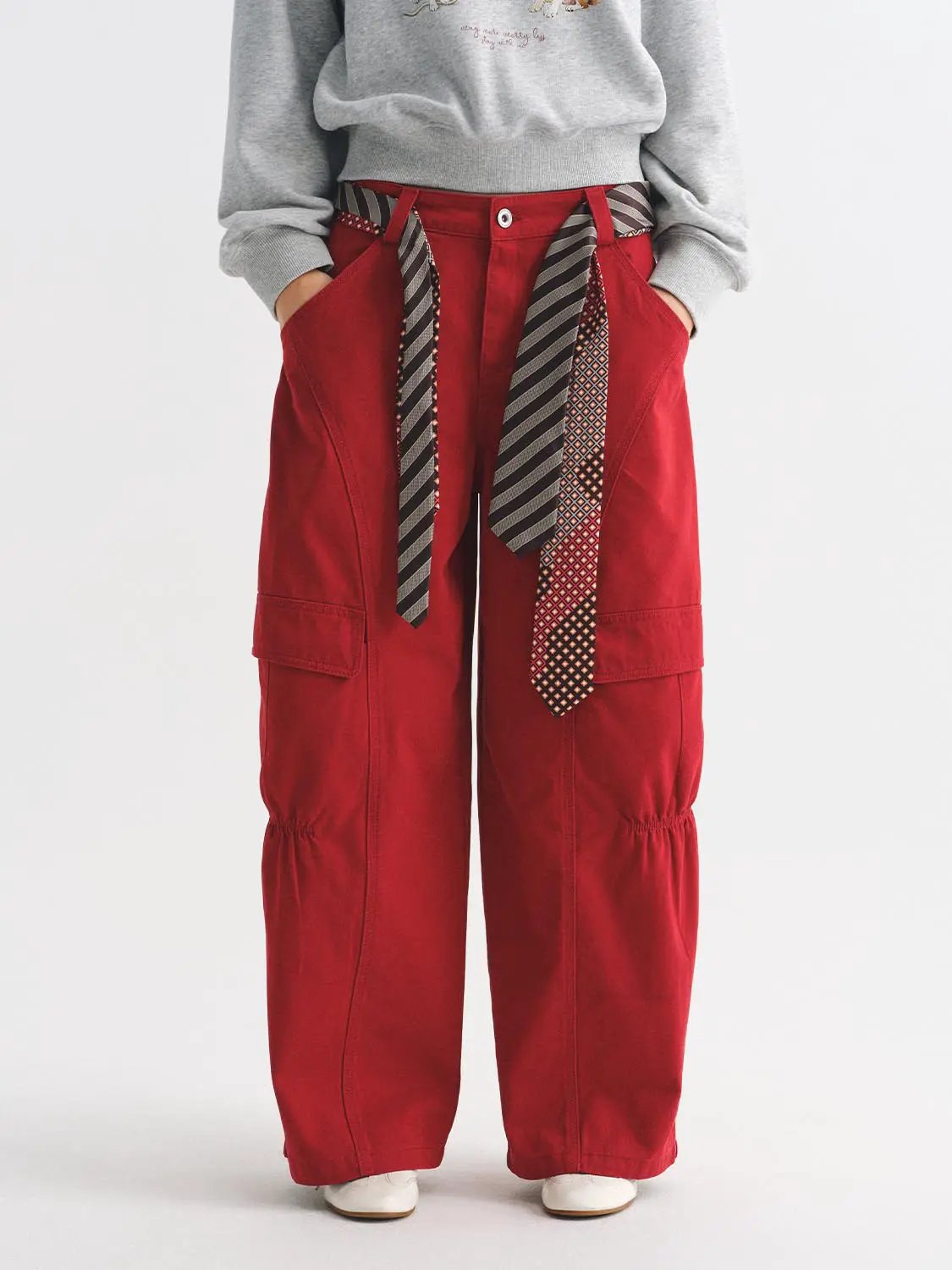 Casual Pants red cargo-style pants with cargo pockets and a striped fabric belt