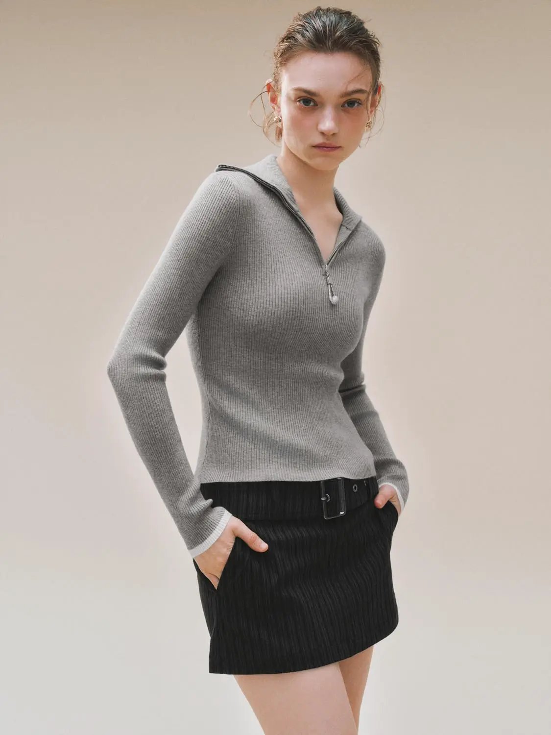 Knit T-Shirts gray ribbed-knit top with front zip on model
