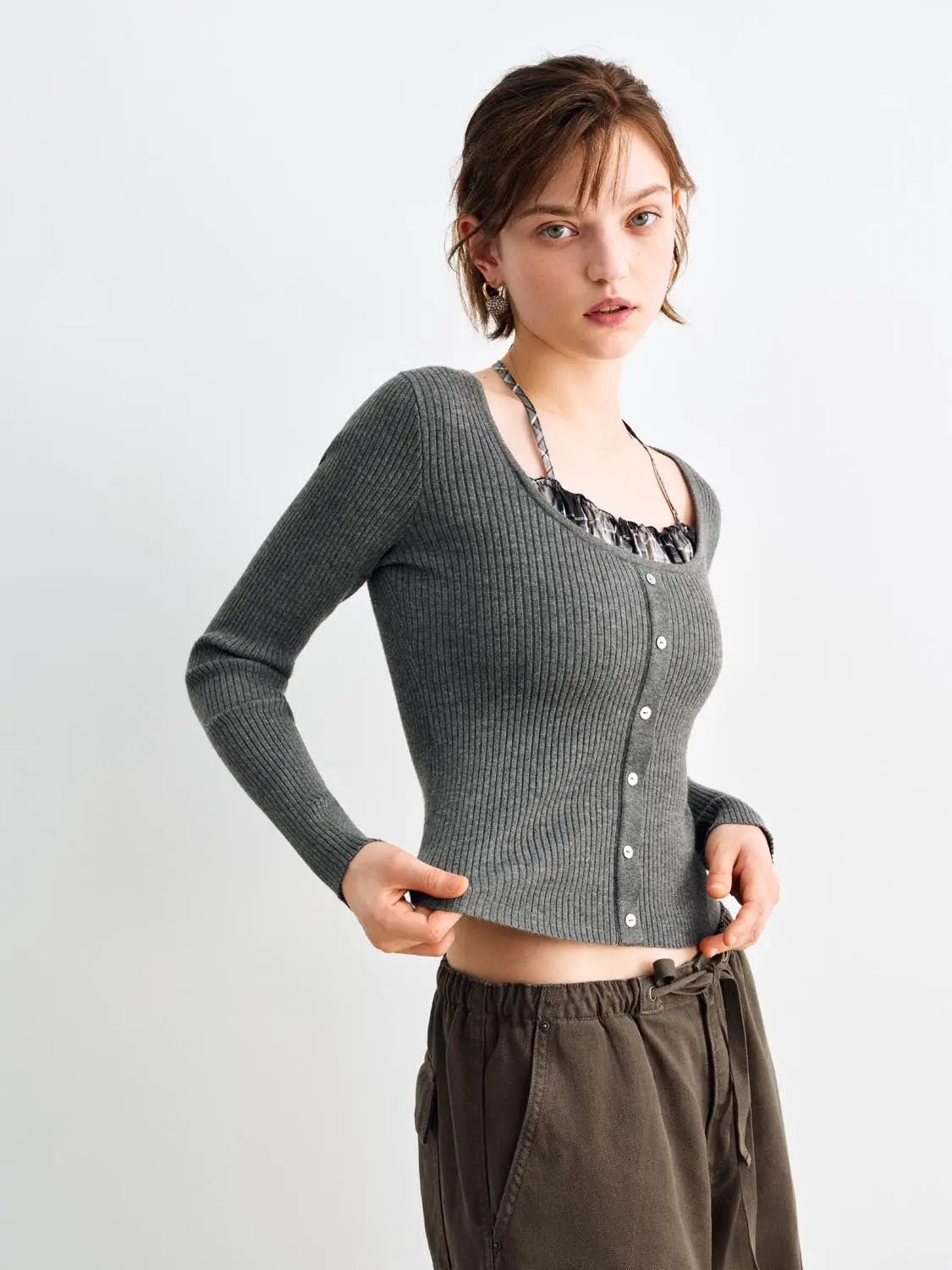 Knit T-Shirt in gray ribbed knit with front buttons worn by a model.