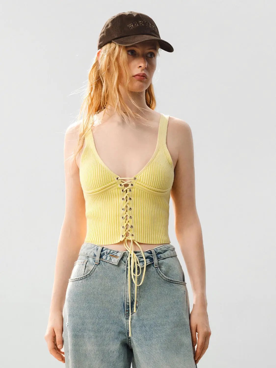 Ribbed Lace-up Sleeveless Cotton Cami Top in yellow with front lace-up detail, worn by model