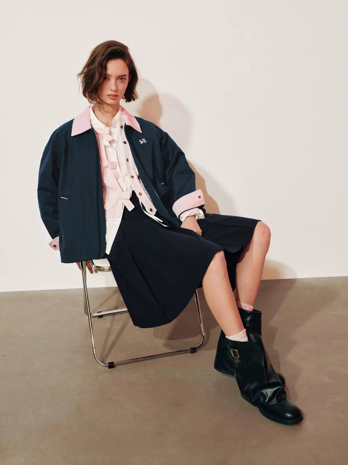 Padded Jacket Urban Revivo navy with pink collar and cuffs, logo on chest, worn by model