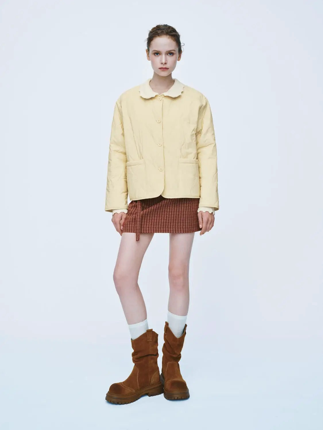 Padded jacket Urban Revivo in pale yellow with large front pockets and button closure.