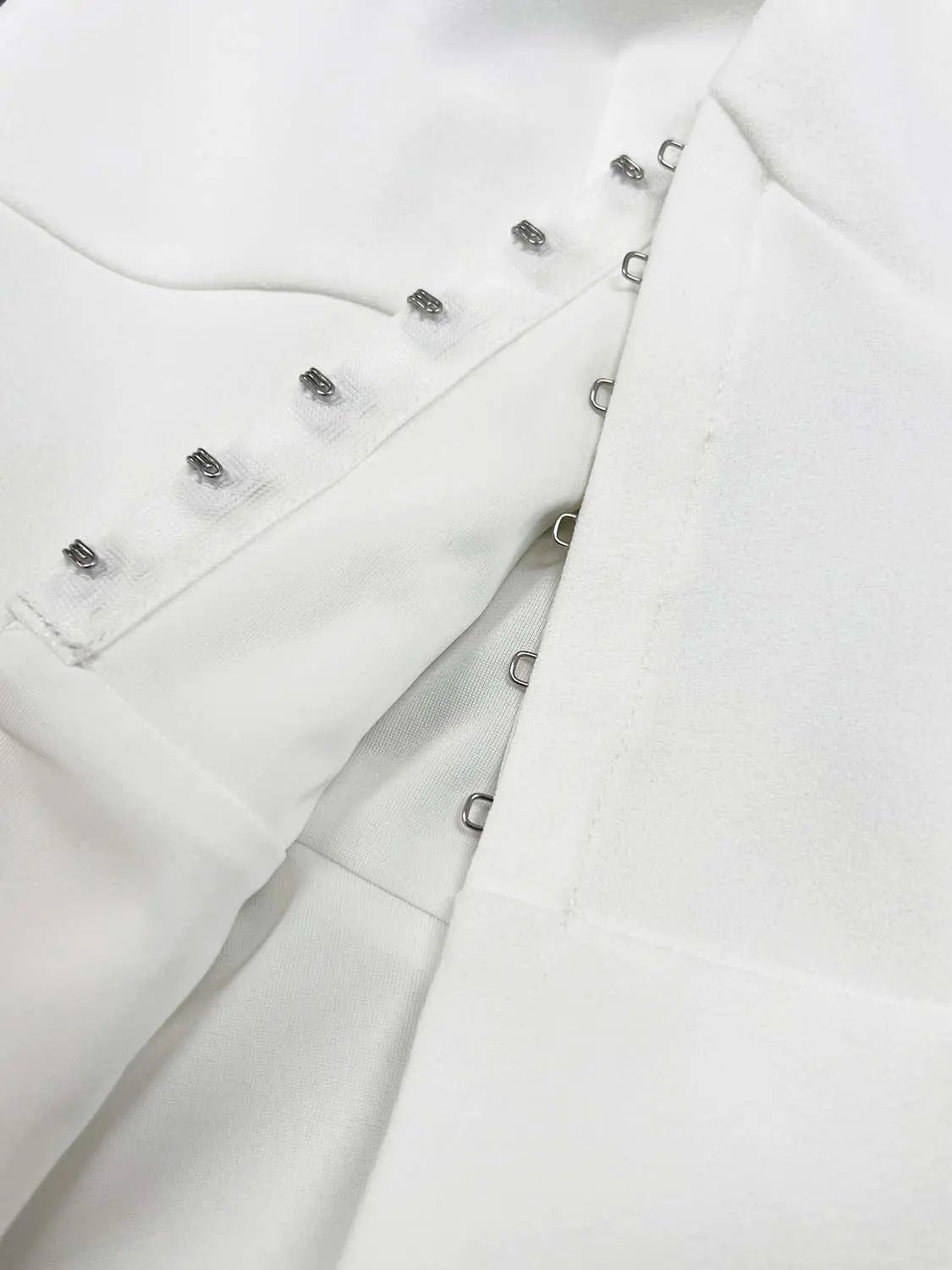 Shirt by Urban Revivo Fashion, white fabric with metal hook closures along placket.