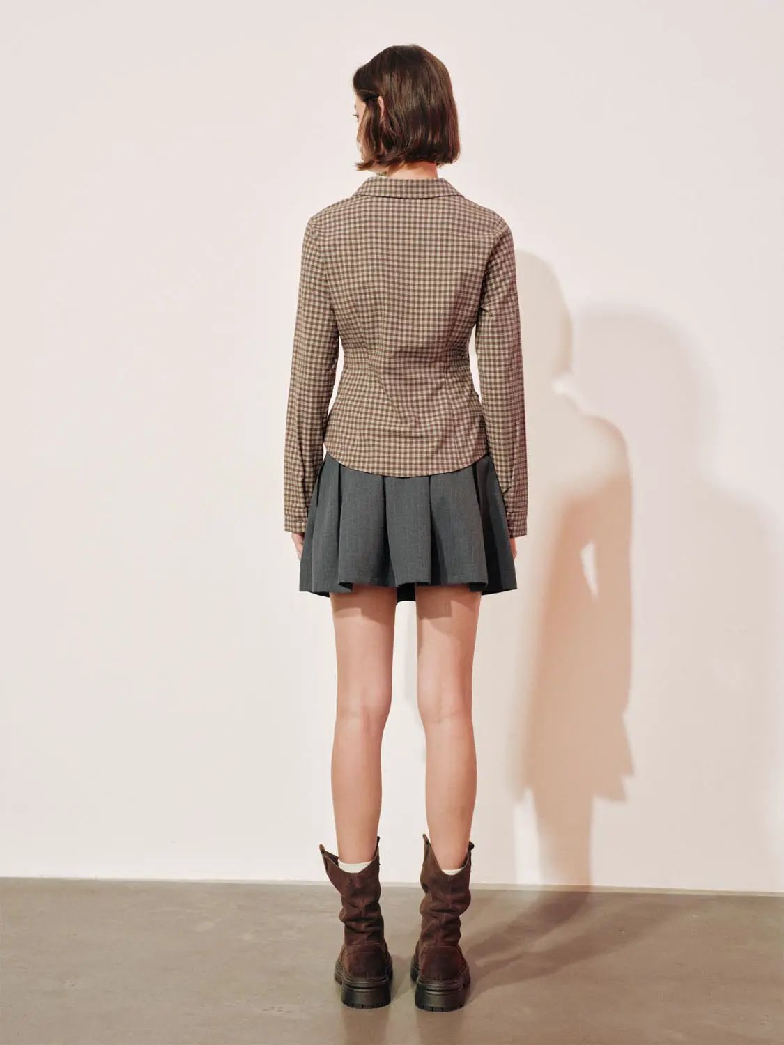 Button-front shirt, brown checkered pattern, long sleeves, back view.