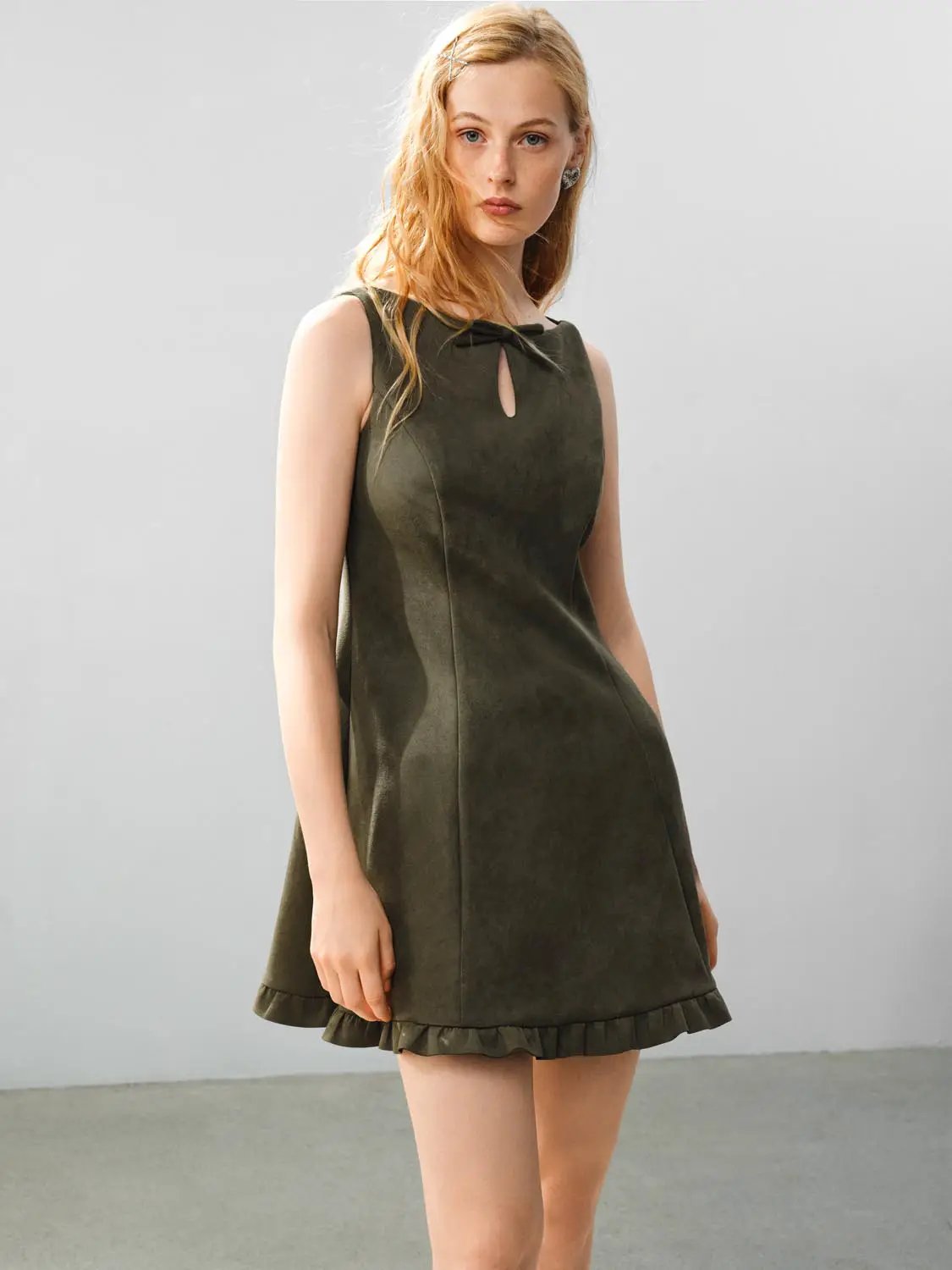 Ruffle Hem Bow Detail Sleeveless A-Line Mini Dress in olive green mock suede.