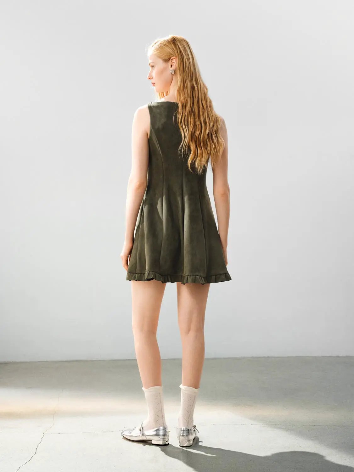 Ruffle Hem Bow Detail Sleeveless A-Line Mini Dress in olive-green suede-like fabric