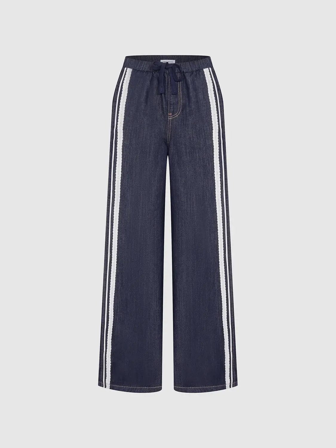 Women's denim wide-leg pants with elastic waistband and drawstring, featuring white side stripe with lace trim.