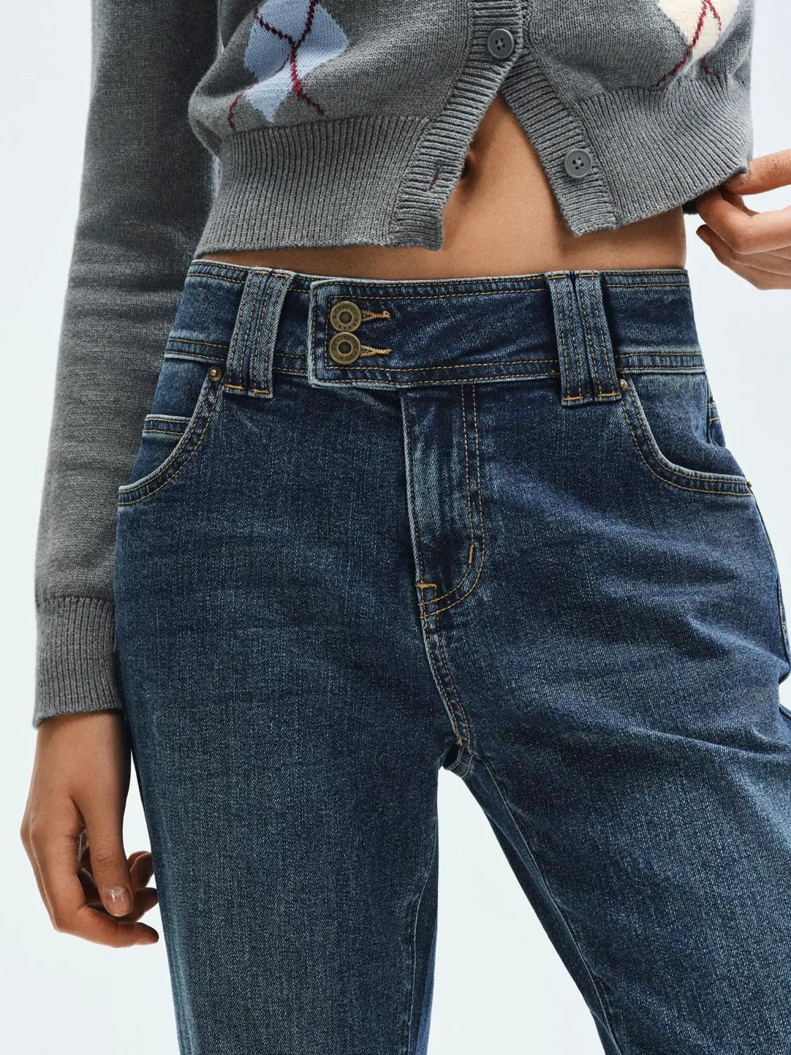 Jeans, dark blue denim with a double-button waist and belt loops.