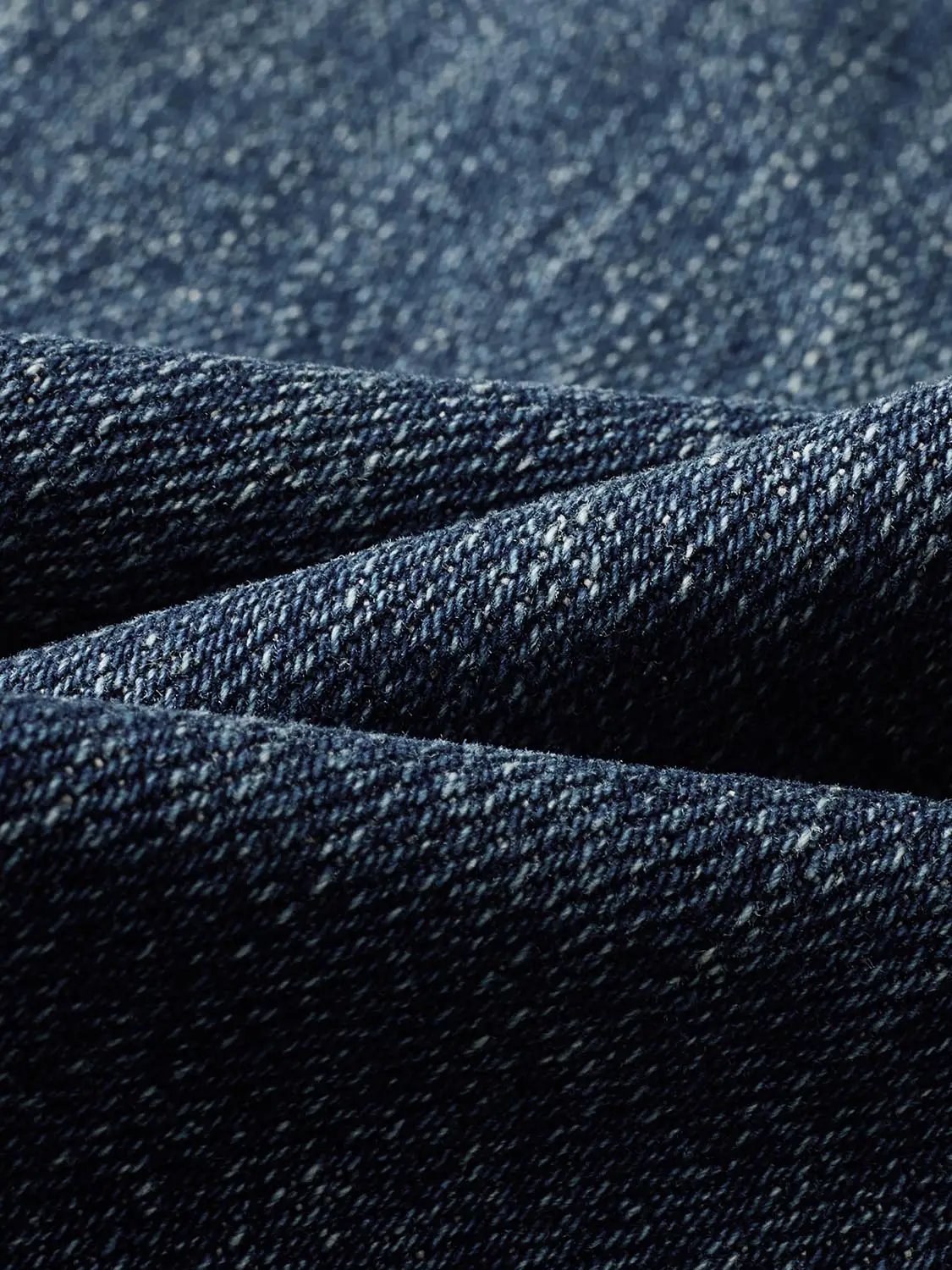 Jeans denim fabric close-up in dark indigo, Urban Revivo Fashion.