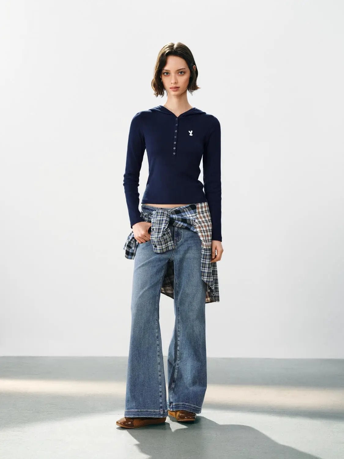 Faded blue wide-leg high-waisted cotton-blend jeans worn with a plaid shirt tied at the waist, Urban Revivo Fashion