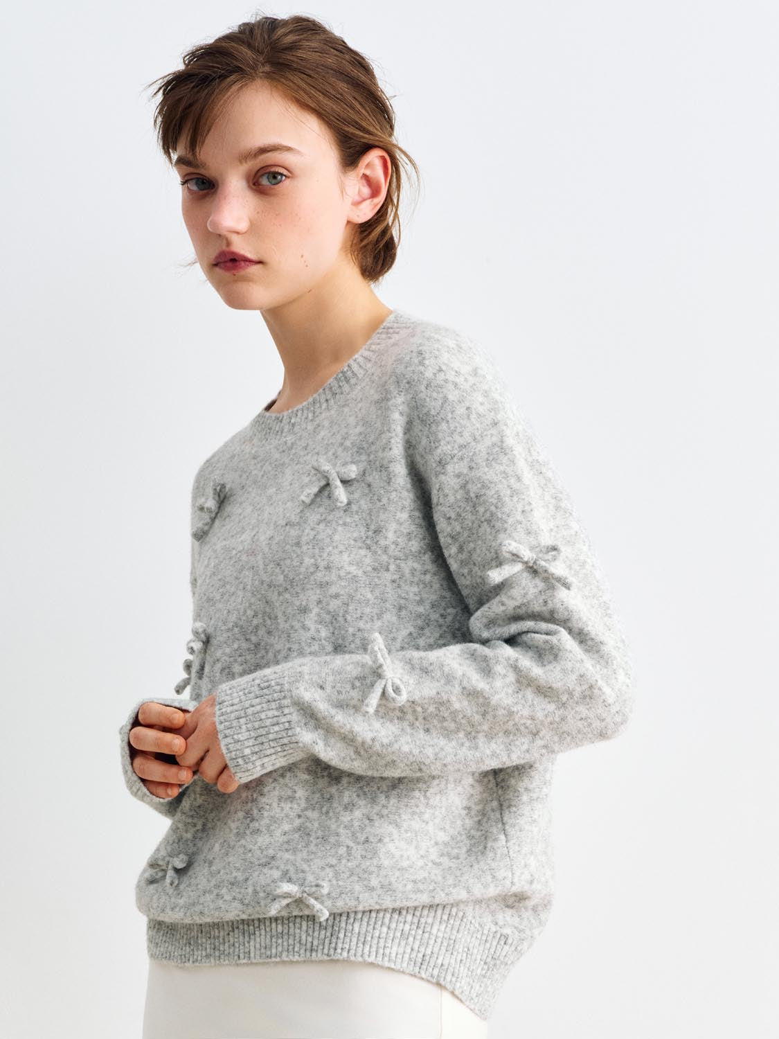 Knit T-Shirt by Urban Revivo Fashion in light gray knit with bow accents on front and sleeves and ribbed hem.