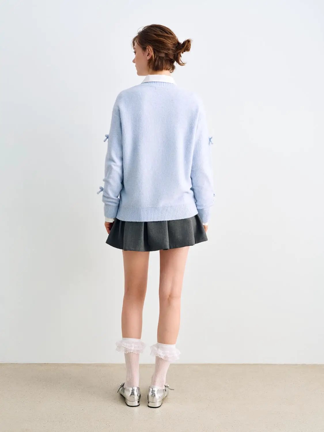 Knit T-Shirt in light blue knit fabric; back view on model with ribbed hem