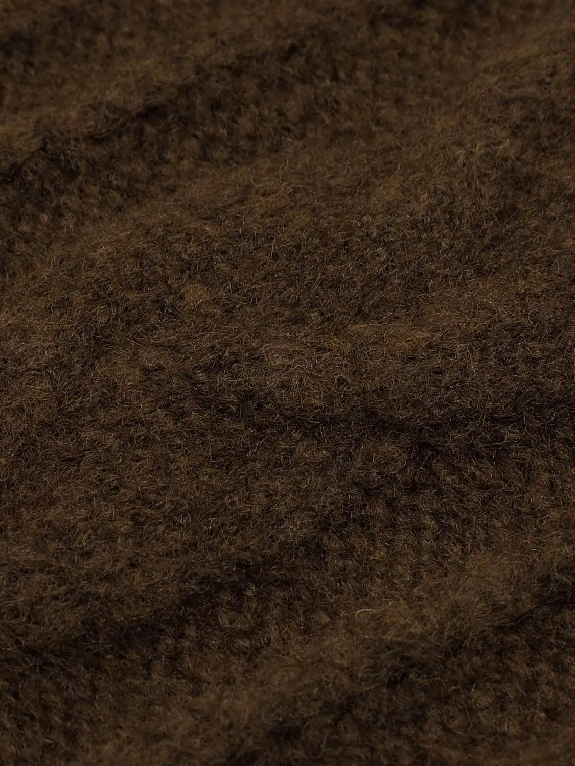 Knit T-Shirts brown knitted fabric close-up with fuzzy texture