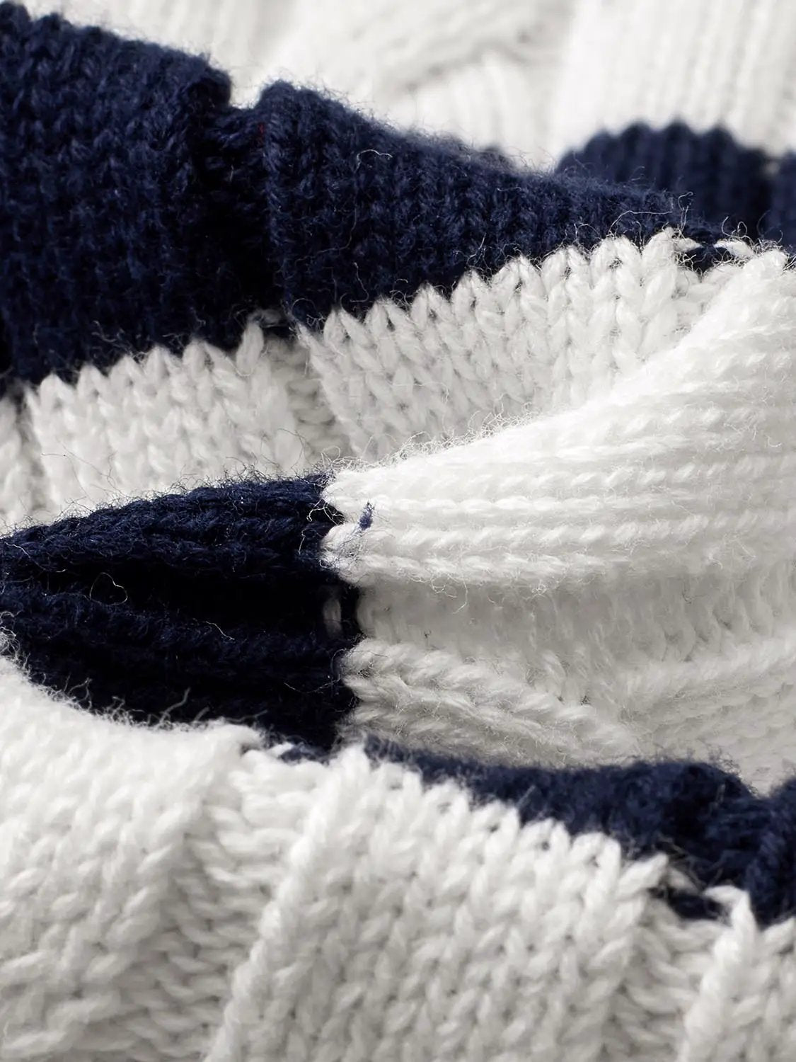 Knitted cardigan with navy and white stripes; chunky knit texture