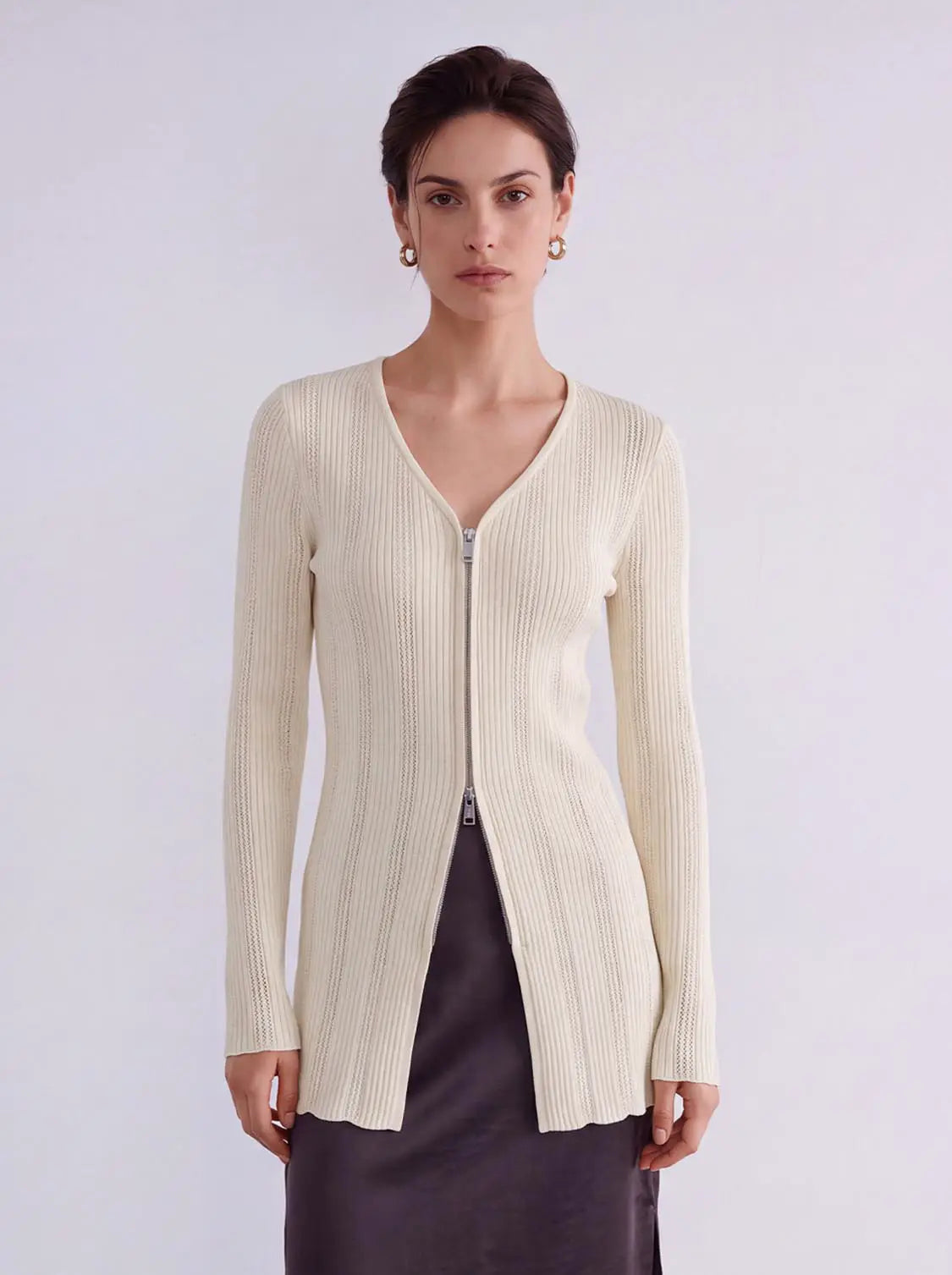 Zip Up Front Knitted Cardigan ivory ribbed knit with long sleeves and front zipper.