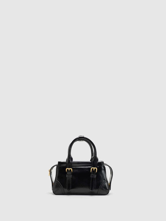 Textured Shell With Twin Buckle Straps And Subtle Stitch Detailing For A Structured Top-Handle Bag