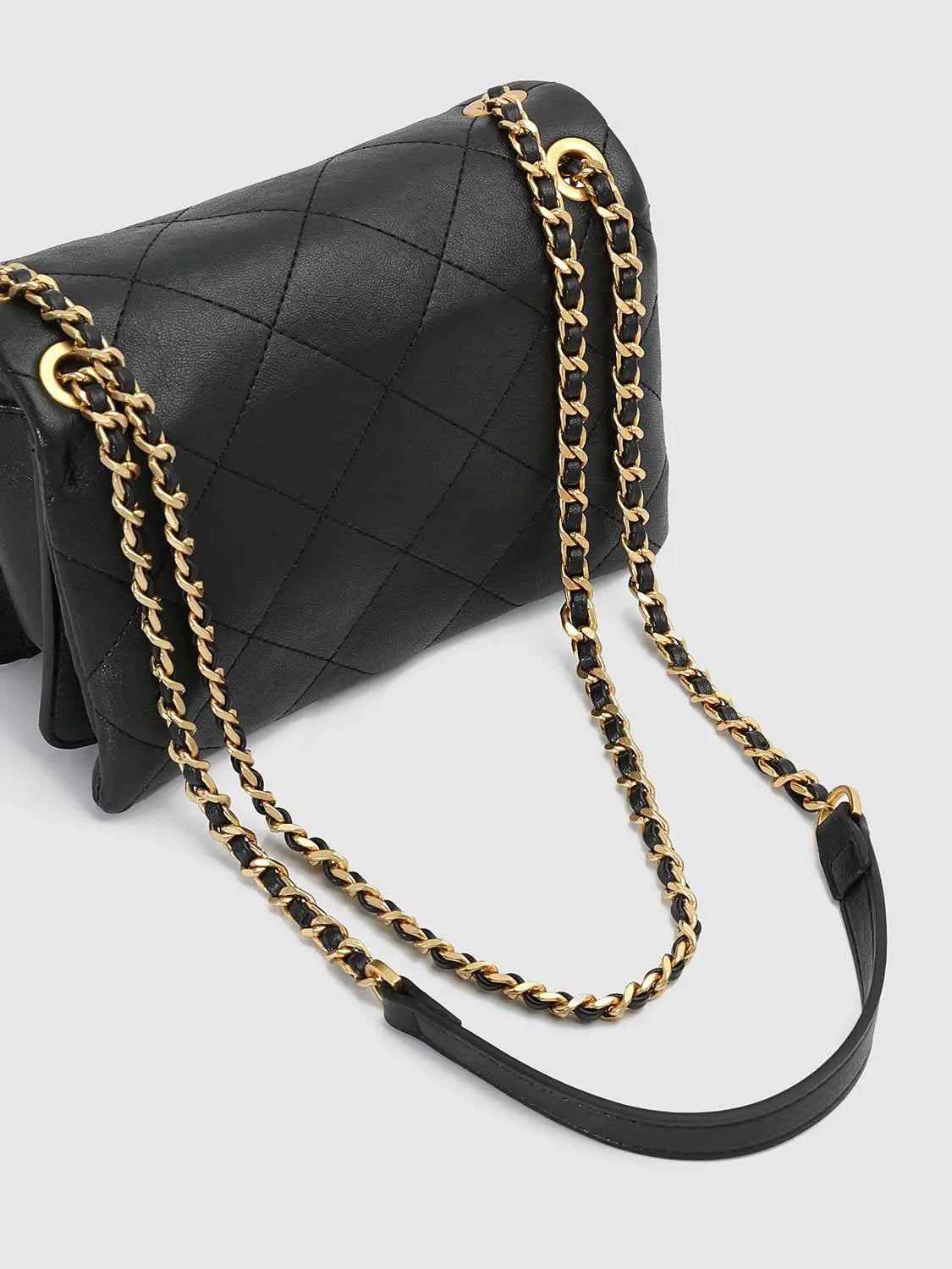 Shoulder & crossbody bag in black quilted leather with gold chain strap by Urban Revivo Fashion