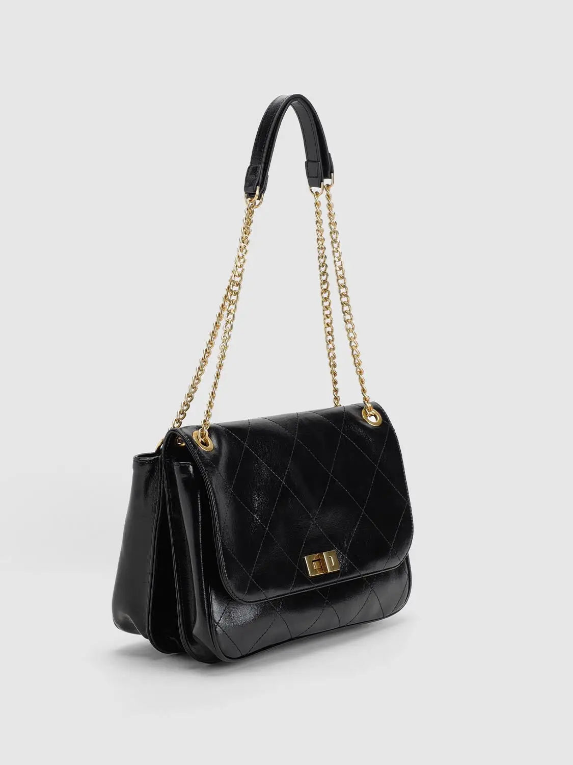 Shoulder bag black quilted leather with gold-tone chain strap and turn-lock clasp.