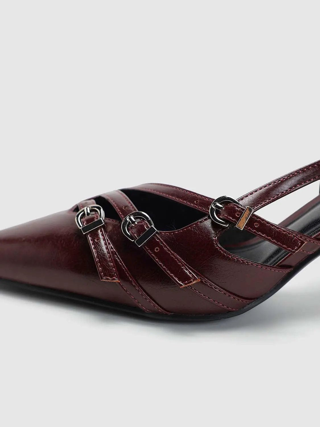 Slingback shoes in burgundy patent leather with three silver buckle straps