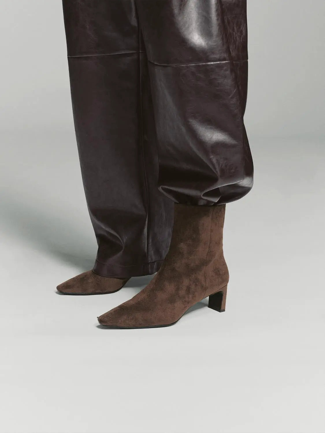 Boots, brown suede mid-calf with pointed toe and block heel.