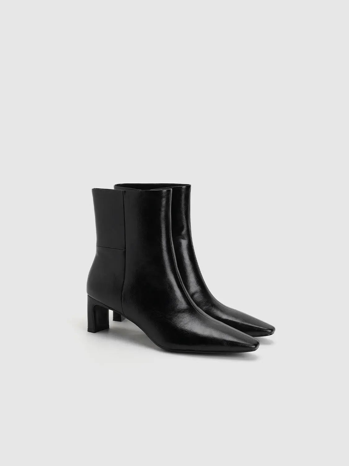 Boots by Urban Revivo Fashion, black leather ankle boots with pointed toe and low block heel.