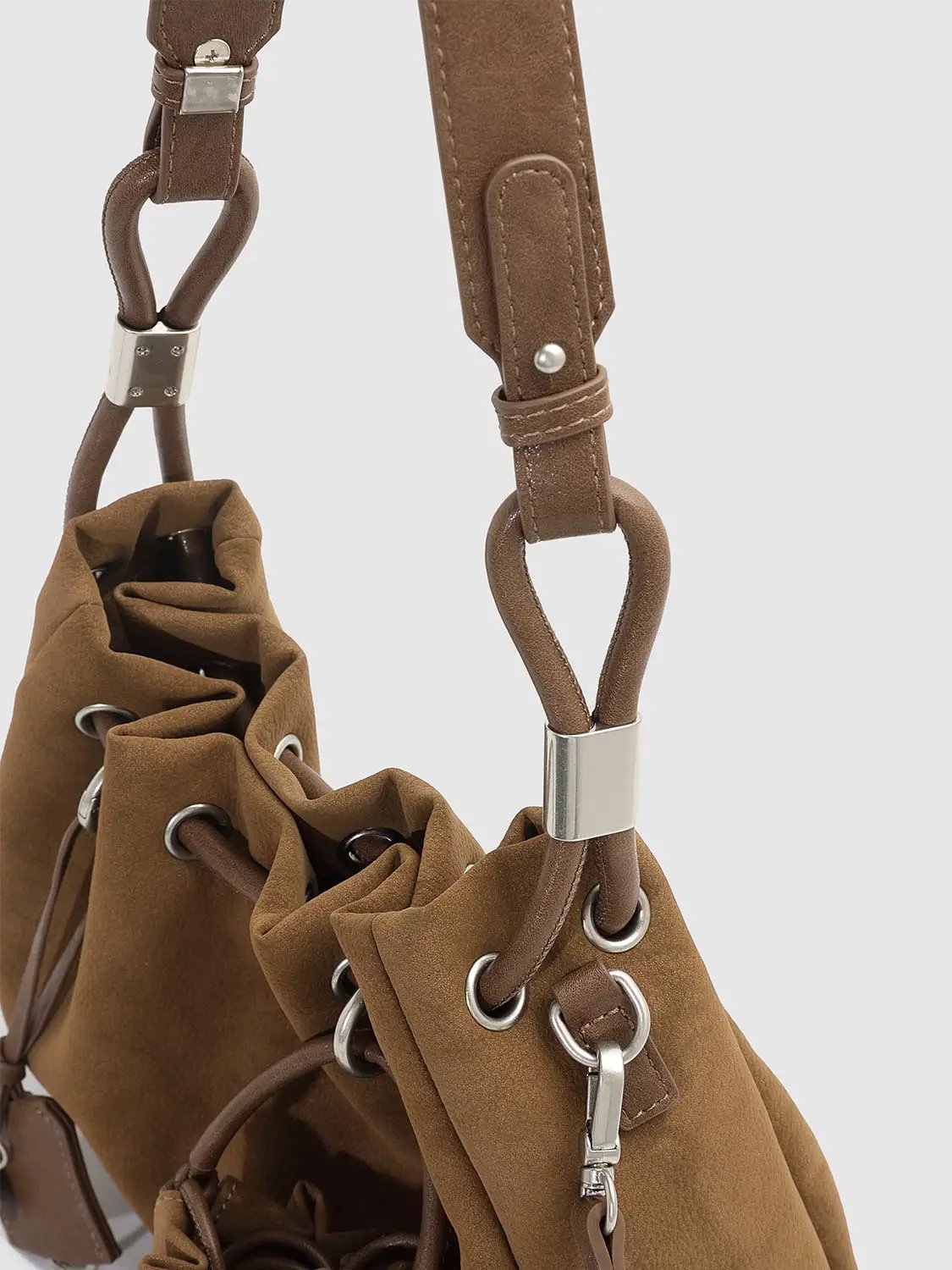 Shoulder & Crossbody Bag in brown with metal hardware and drawstring grommet closure, Urban Revivo Fashion.
