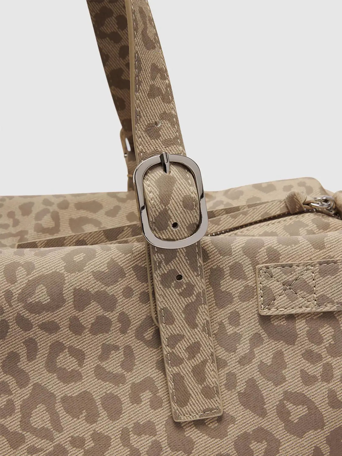 Shoulder & crossbody bag by Urban Revivo in beige leopard-print canvas with metal buckle strap