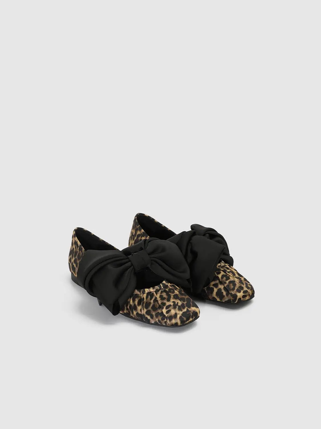 Leopard print flats by Urban Revivo Fashion with oversized black bow, pair