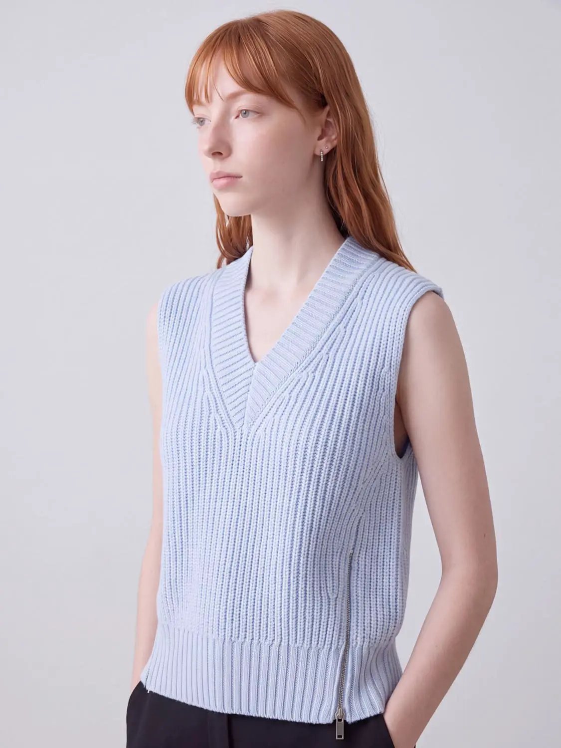 Loose V-Neck Knitted Vest in light blue, sleeveless ribbed knit with side zip.