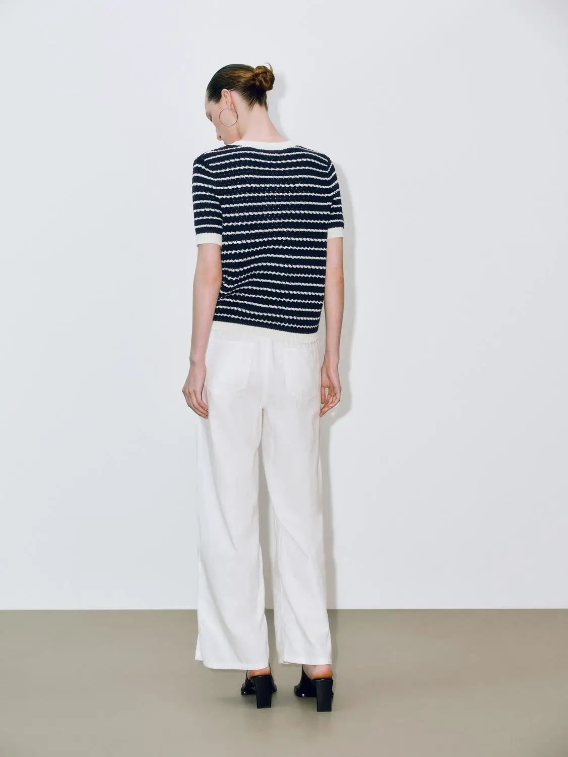 Round neck striped knit cotton T-shirt, navy and white, short sleeves, worn by model