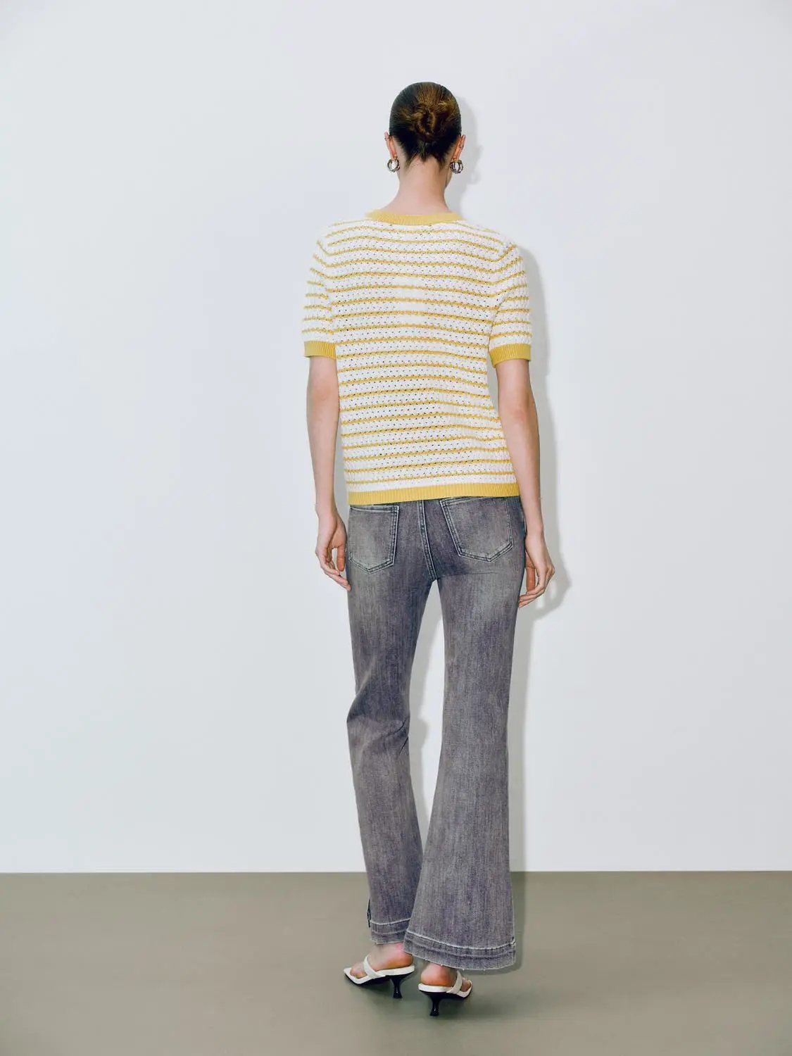 Round neck striped knit cotton T-shirt by Urban Revivo Fashion in yellow and white, back view on model.