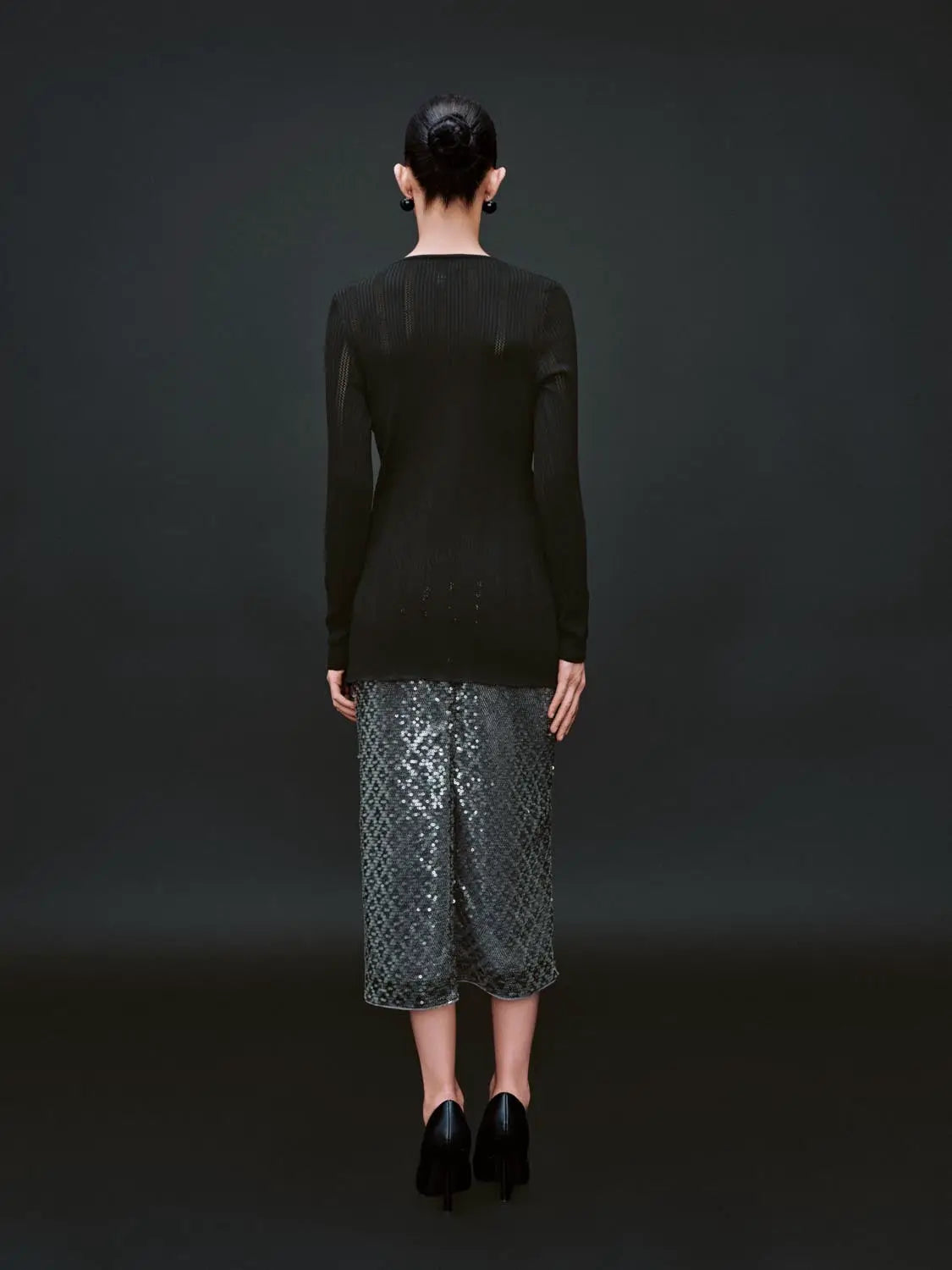 Zip Up Front Knitted Cardigans, black knit, long sleeves; model wearing a sequined skirt