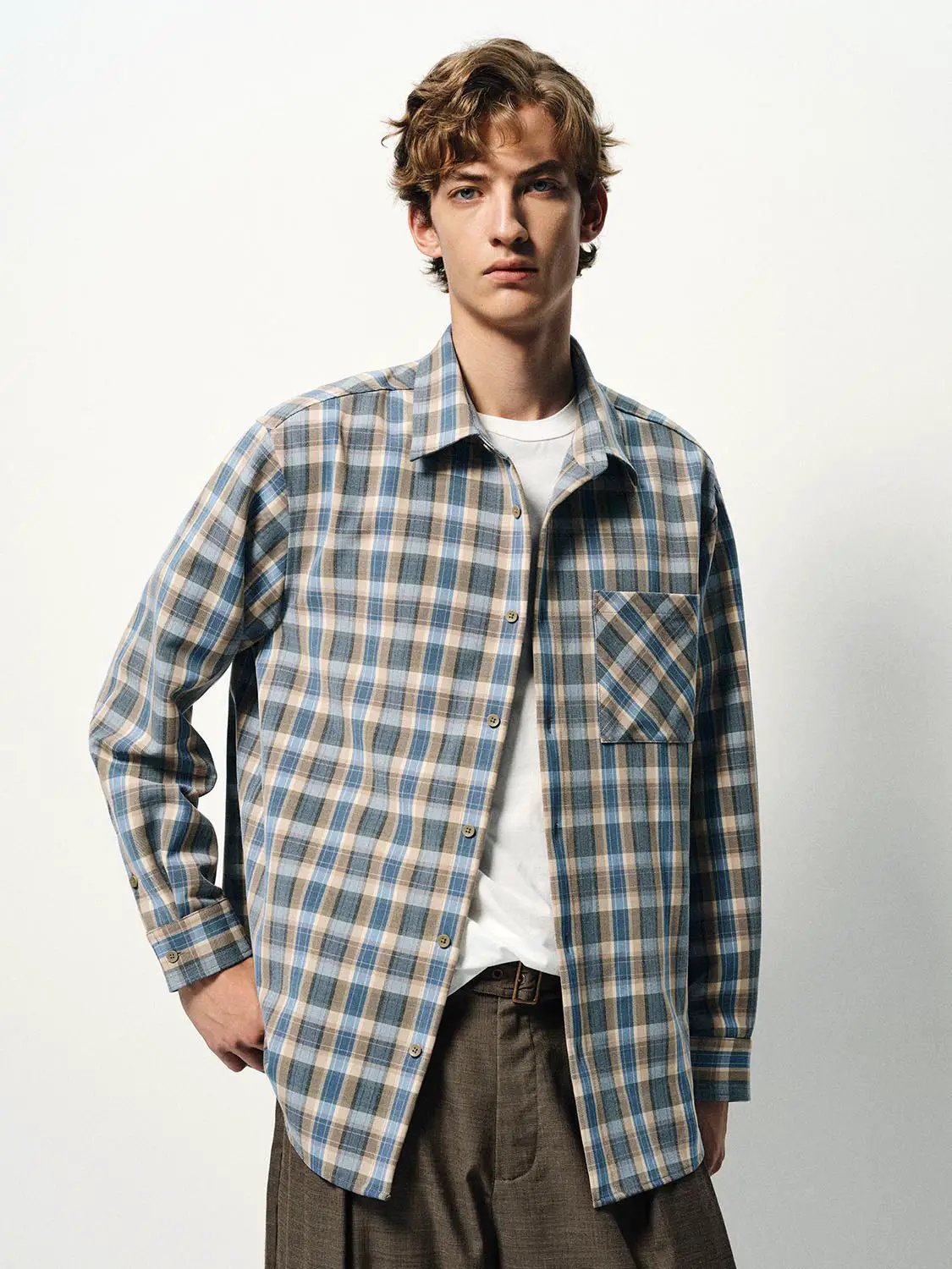Shirt with blue and beige plaid, long-sleeve button-down with chest pocket.