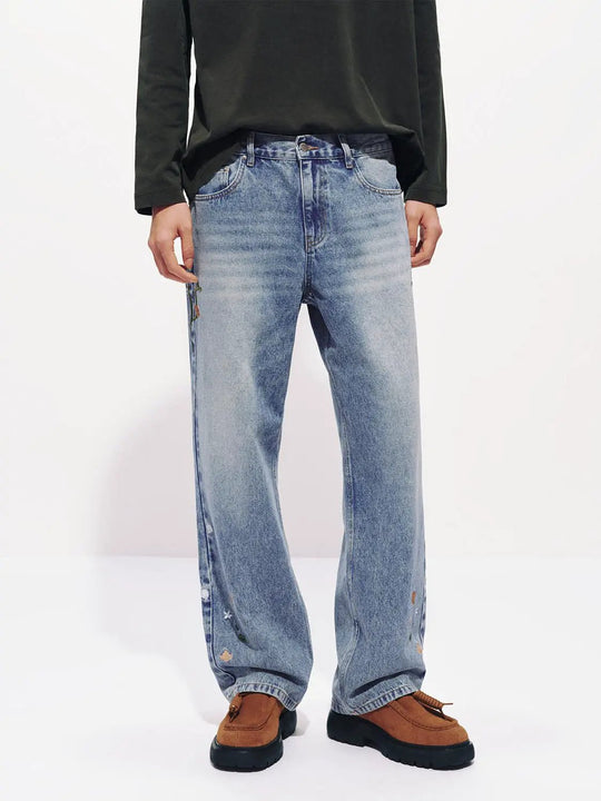 Bestickte Baumwolljeans mit Blumenmuster, verwaschener Waschung und weitem Bein