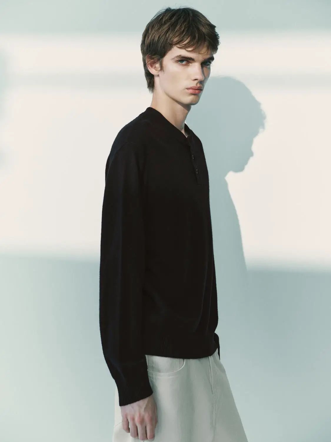 Knit T-Shirt, black long-sleeve knitted top with henley-style button placket.