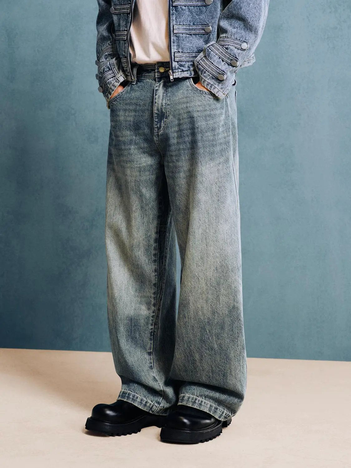 Jeans, light-wash denim with a relaxed wide-leg fit and front pockets.