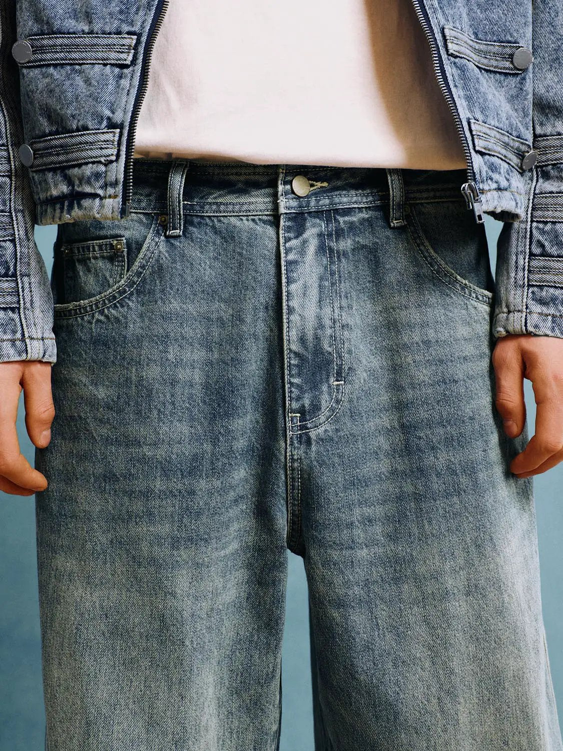 Jeans, light-wash blue denim with metal button and zip fly