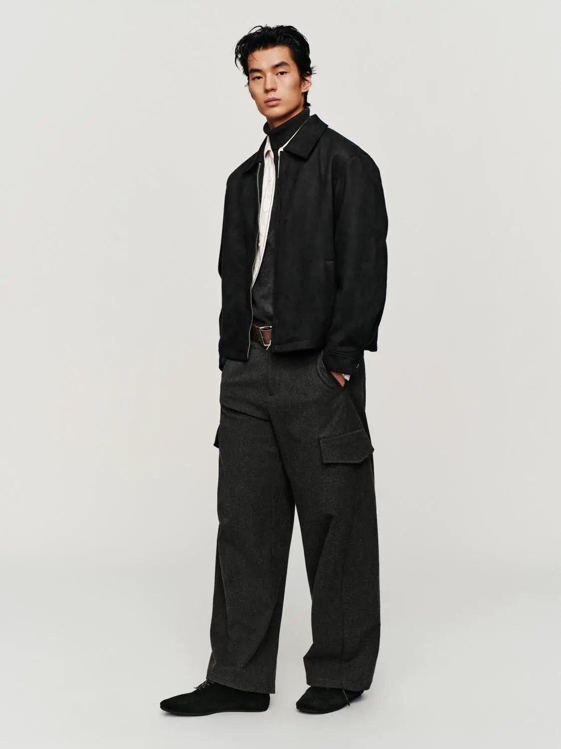 Jacket, black suede with zip-front; worn by male model in dark pants.
