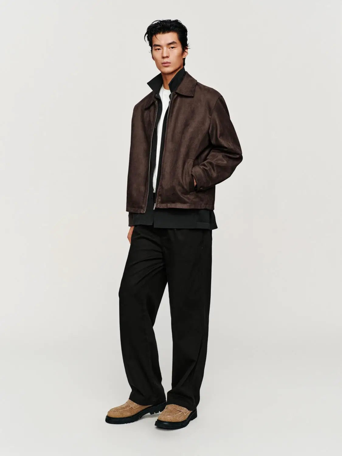 Jacket brown suede with zip-front closure worn by a male model