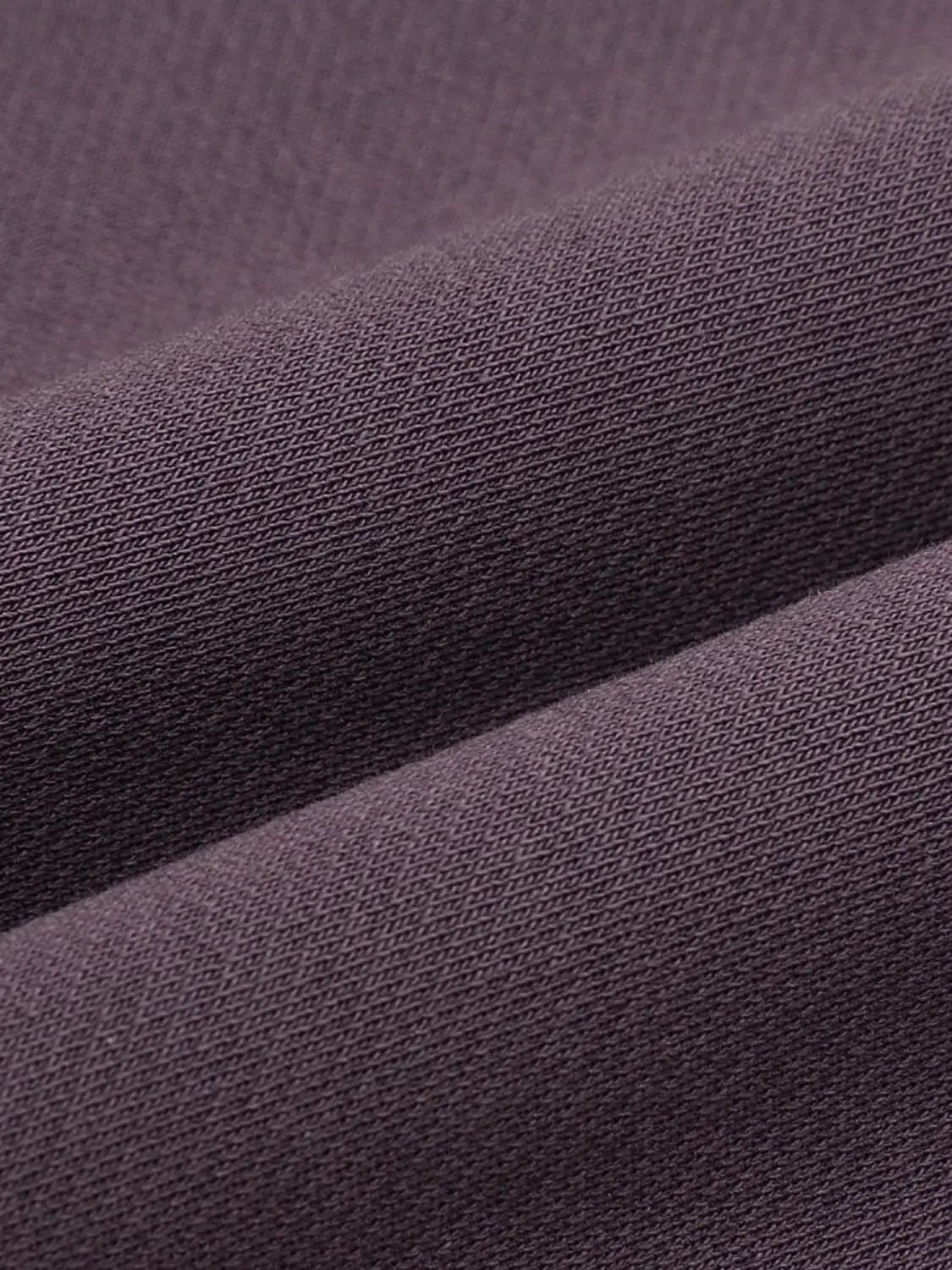 Sweatshirt fabric in deep purple, close-up knit texture; Urban Revivo Fashion.