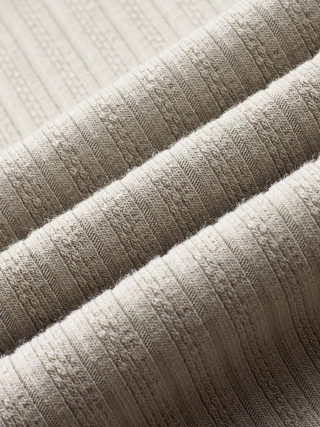 Polo shirt by Urban Revivo in beige ribbed fabric close-up
