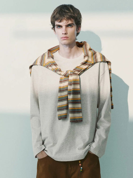 Top a maniche lunghe in cotone drappeggiato con scialle a righe