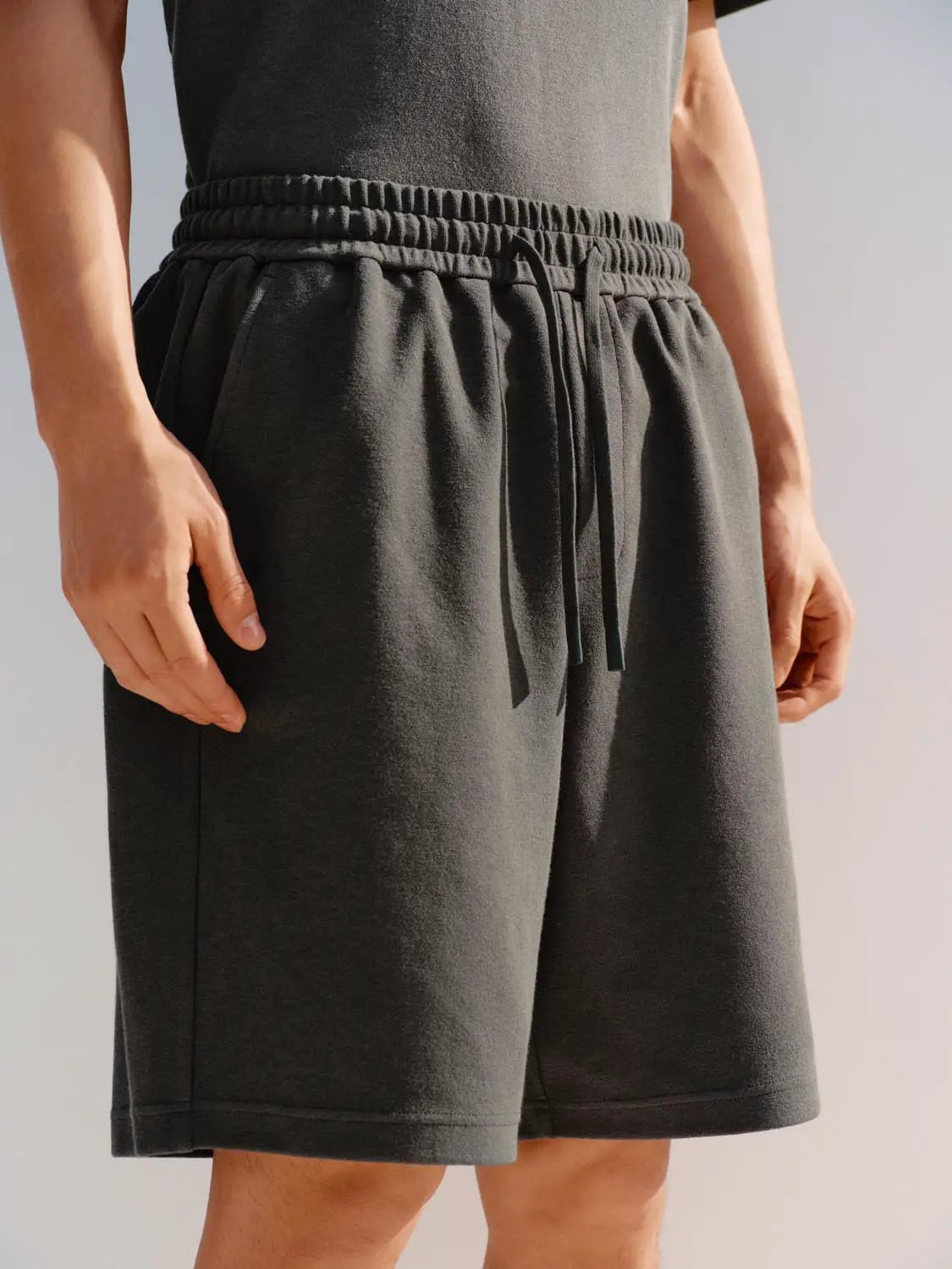 Elastic drawstring waist cotton-blend shorts for men in dark gray.